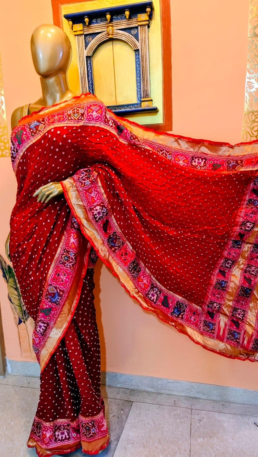 Drape of the vermilion saree
