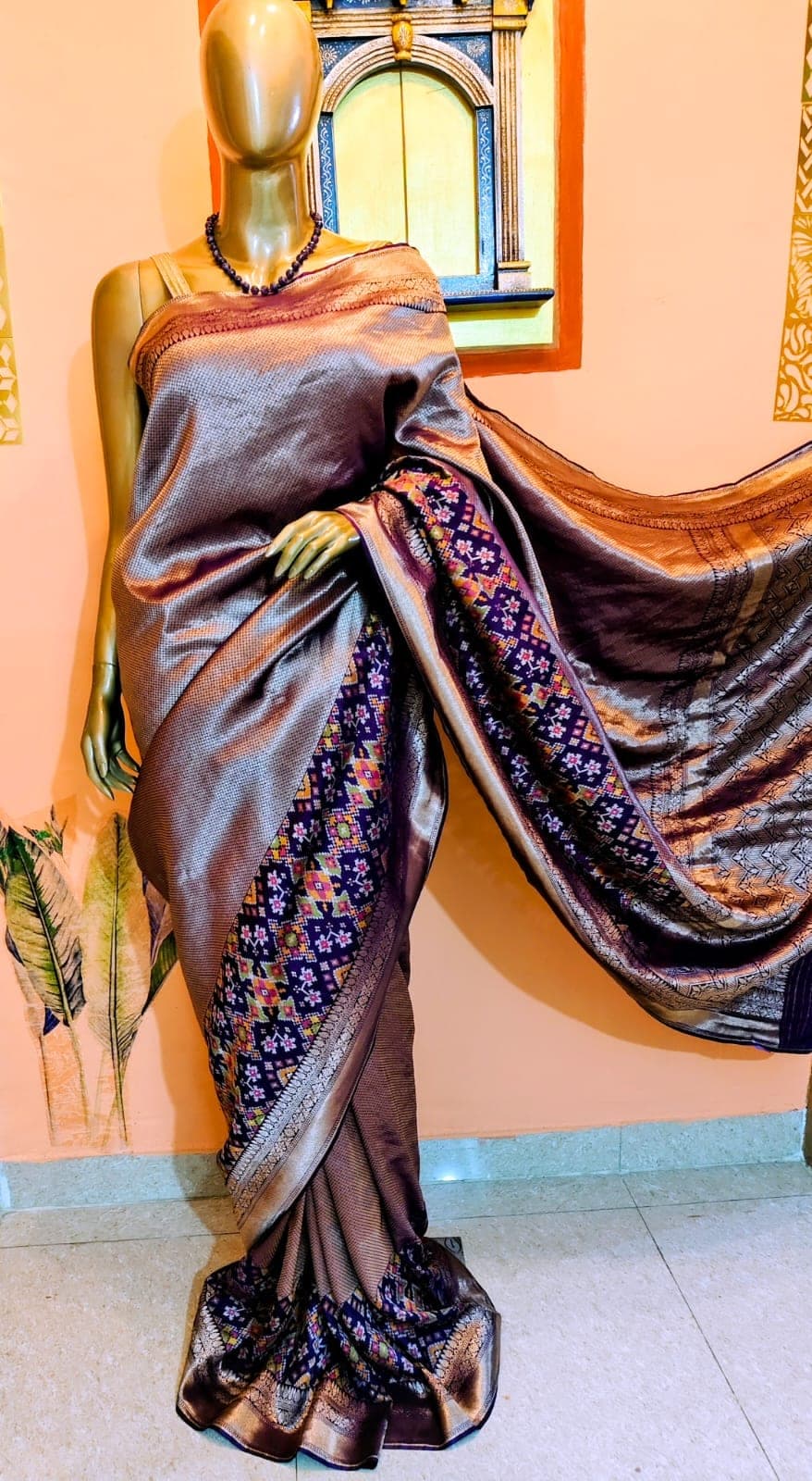 Drape of the antique-gold saree