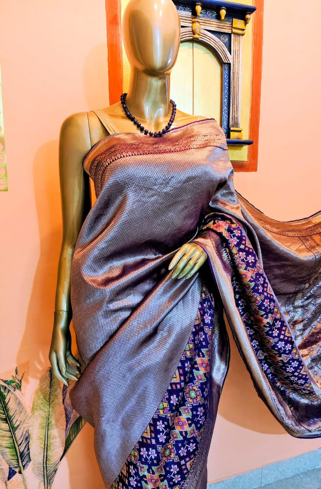 The shifting gold-to-violet tone of the fabric