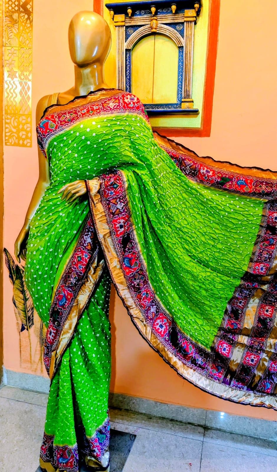 Drape of the parrot-green saree