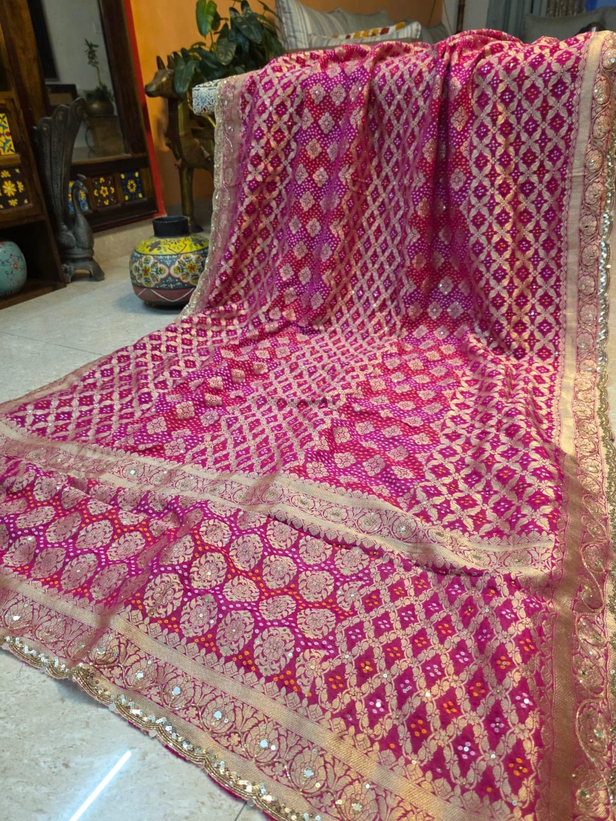 Alternative full view of the magenta bandhej saree