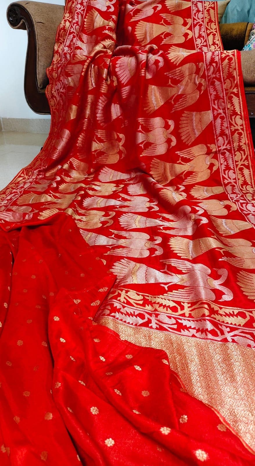 Folded detail of the red saree and blouse piece
