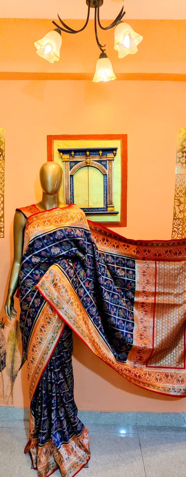 Royal-blue Semi-Benarasi Patola saree draped on a stand