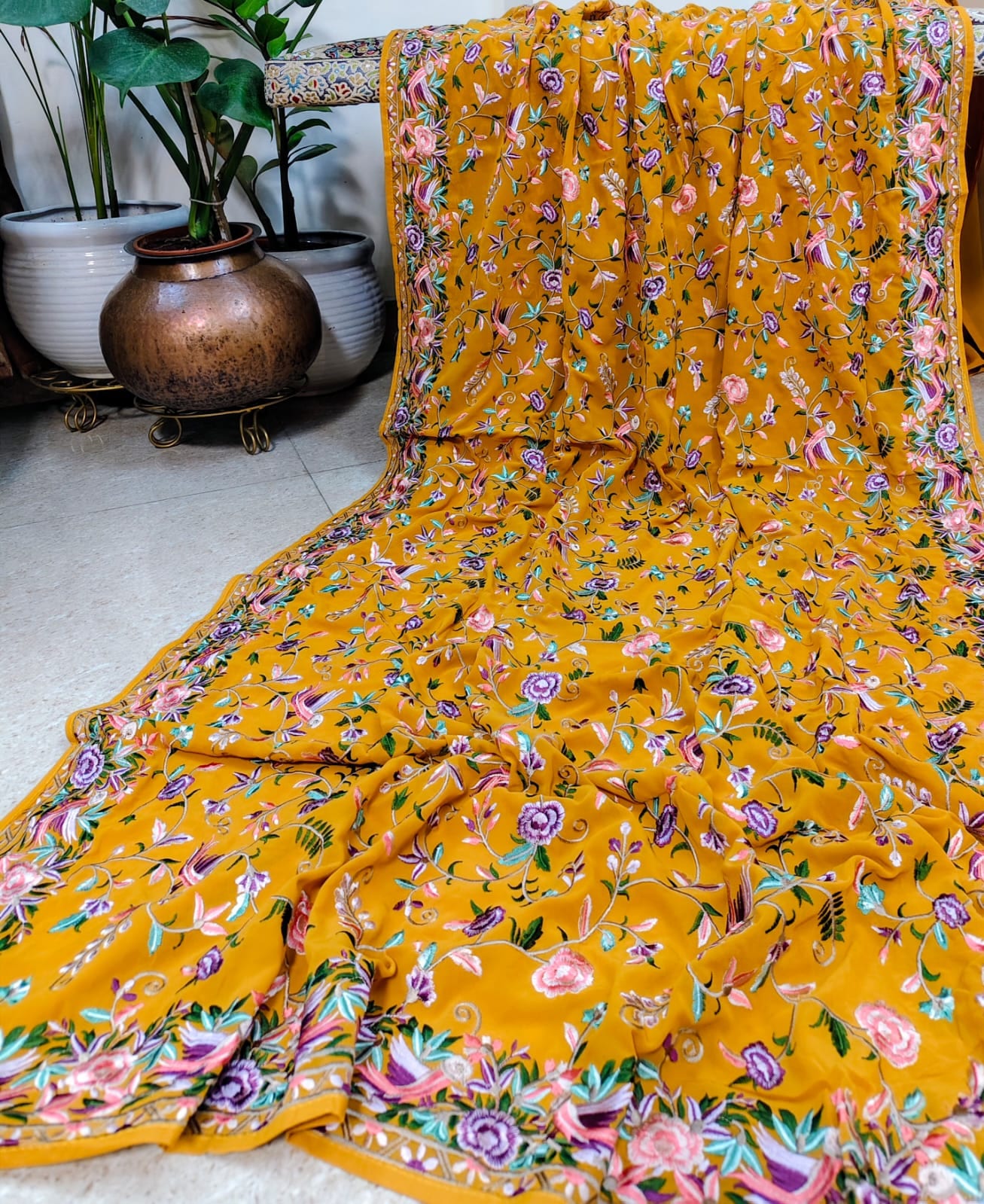 Mustard georgette saree with an all-over multicolour floral print